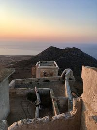 Old ruins against sky during sunset