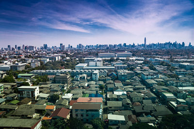 High angle view of buildings in city against sky