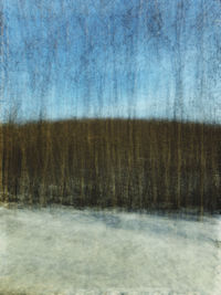 Scenic view of land against sky during winter