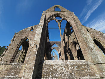 Low angle view of old building against sky