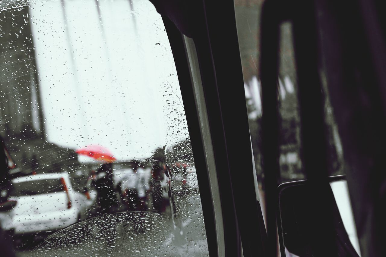 window, glass - material, transparent, drop, wet, indoors, rain, water, vehicle interior, transportation, mode of transport, car, glass, land vehicle, looking through window, raindrop, season, weather, car interior, windshield