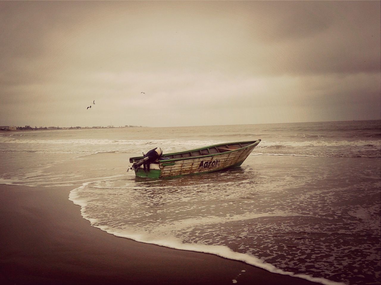 sea, water, horizon over water, beach, shore, sky, nautical vessel, sand, transportation, boat, scenics, mode of transport, beauty in nature, tranquility, nature, tranquil scene, vacations, leisure activity, lifestyles