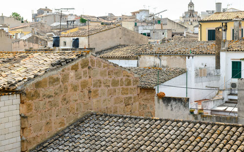 Rooftops over the majorcan medina in the summer sun