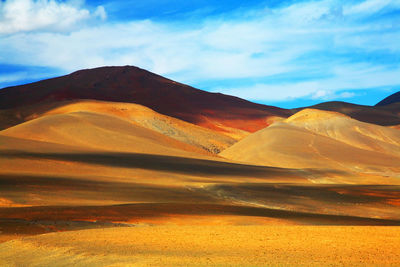 Scenic view of landscape against blue sky