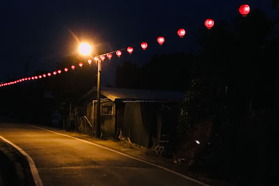 View of illuminated street at night