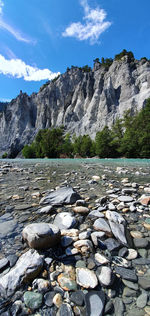 Rocks on shore against sky