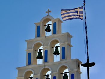 Bell hanging against sky