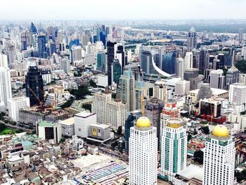 High angle view of modern buildings in city against sky