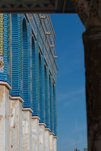 Low angle view of building against blue sky