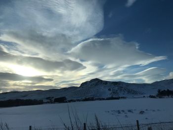 Scenic view of mountains against sky during winter