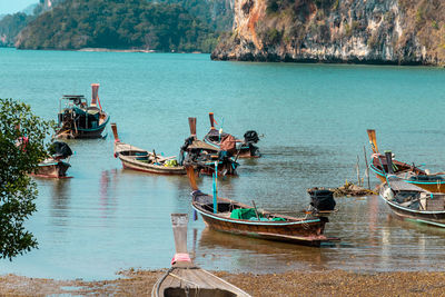 Boats moored in sea