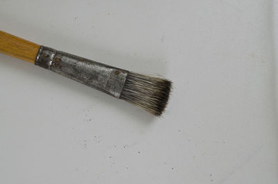 Directly above shot of paintbrush on table