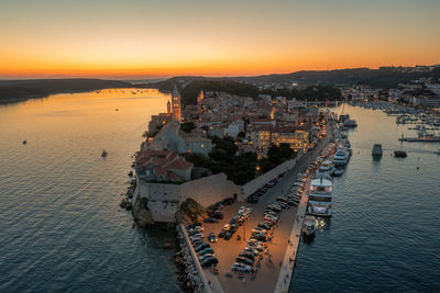 High angle view of city at sunset