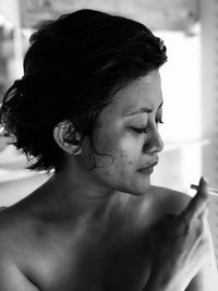Portrait of young woman looking away