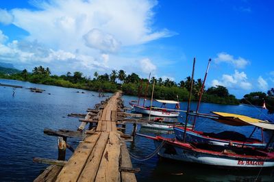 Boats moored at pier