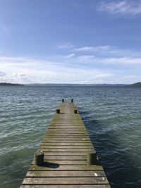 Pier over sea against sky