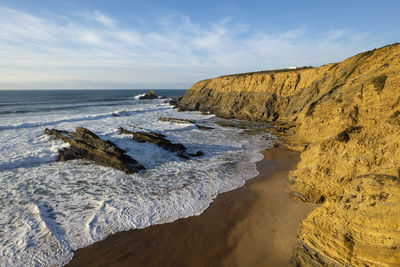 Scenic view of beach against sky