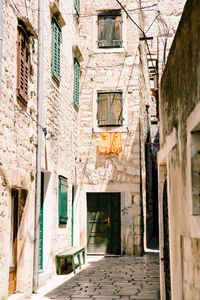 Narrow alley amidst old buildings in town