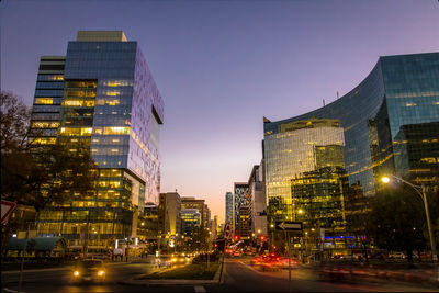 Illuminated buildings in city at night