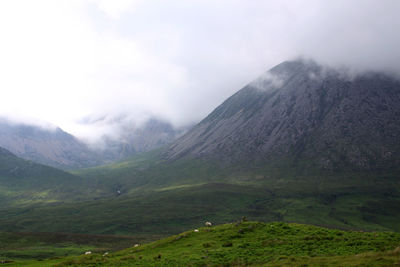 Scenic view of mountains in foggy weather