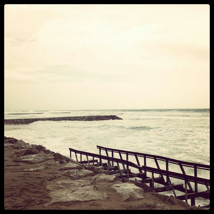 sea, water, horizon over water, tranquil scene, tranquility, scenics, beauty in nature, sky, railing, nature, transfer print, beach, pier, auto post production filter, idyllic, shore, outdoors, calm, remote, no people