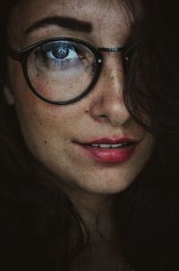 Close-up portrait of woman wearing eyeglasses