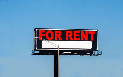 Blank billboard for rent on a busy highway in the usa