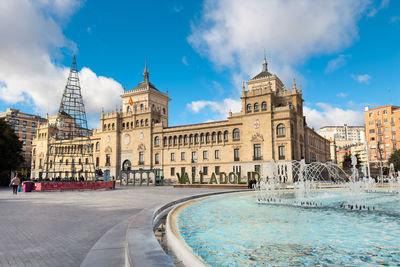 Buildings in city against sky