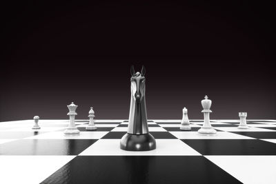 Row of chess pieces on floor