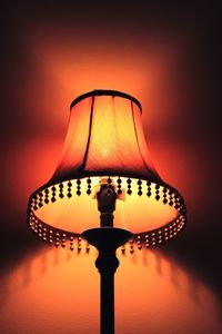 Close-up of illuminated lamp at home