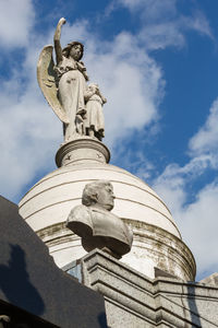 Low angle view of statue against sky