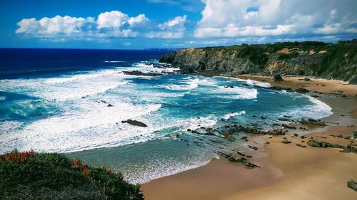 Scenic view of beach against sky