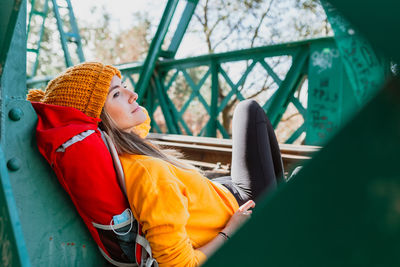 Portrait of woman looking away while sitting in car