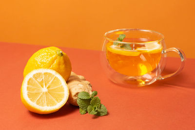 Close-up of orange juice on table