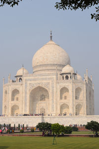 Low angle view of taj mahal against clear sky on sunny day