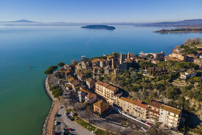Aerial view of passignano sul trasimeno, a small town along the lake near perugia