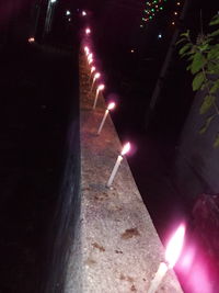 High angle view of illuminated street at night