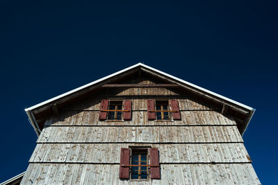 Low angle view of built structure against blue sky