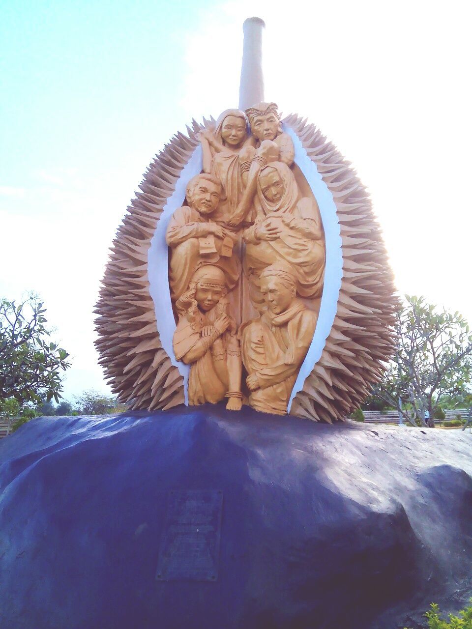 sculpture, art and craft, art, statue, human representation, creativity, low angle view, animal representation, craft, carving - craft product, religion, buddha, clear sky, no people, sky, tree, day, outdoors