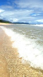 Scenic view of beach against sky
