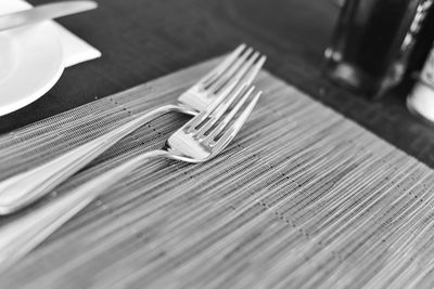 High angle view of forks on table