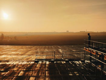 Man at tempelhofer feld during sunset