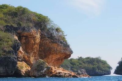 Scenic view of rock formation in sea