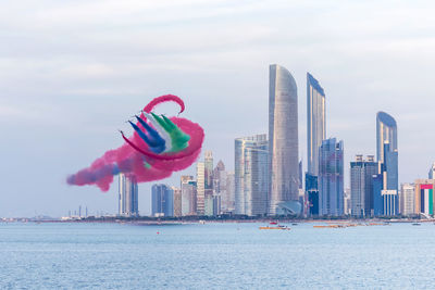 Al fursan aerobatic team doing stunts in the sky in abu dhabi, uae for national day celebrations