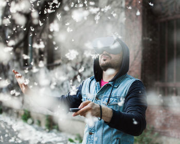 Young man wearing virtual reality glasses