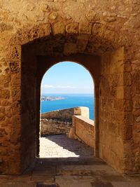 View of sea seen through archway