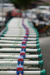 Close-up of shopping carts in row outdoors