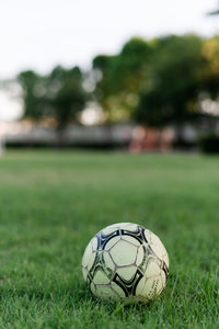 Close-up of soccer ball on field