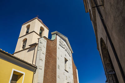 Low angle view of building against blue sky