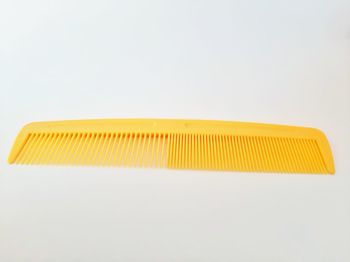 Close-up of yellow pencil against white background